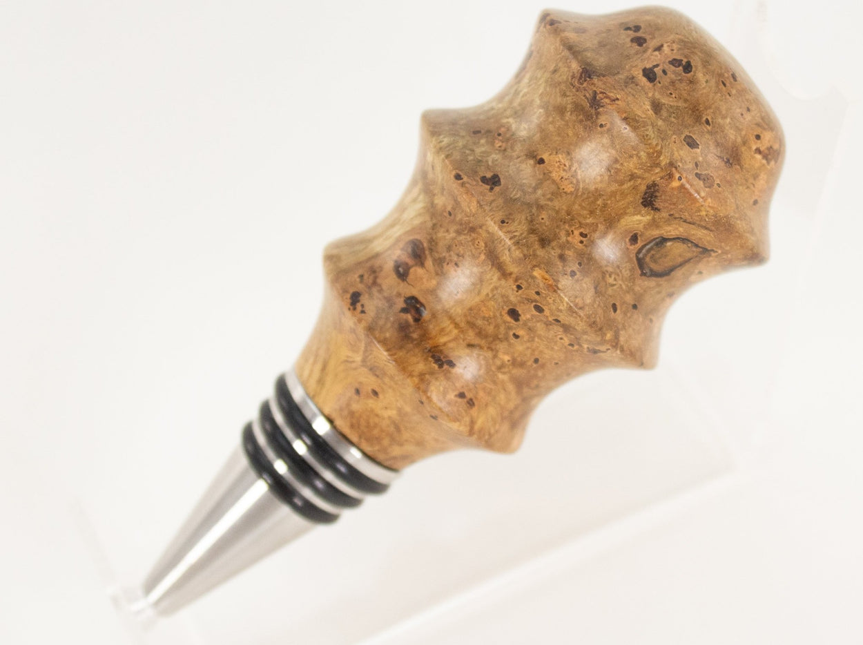 This handmade wooden stopper is made from Black Cherry Burl. This custom one-of-a-kind wooden wine stopper was turned from a burl that was harvested next to the Kennebec River in Maine.