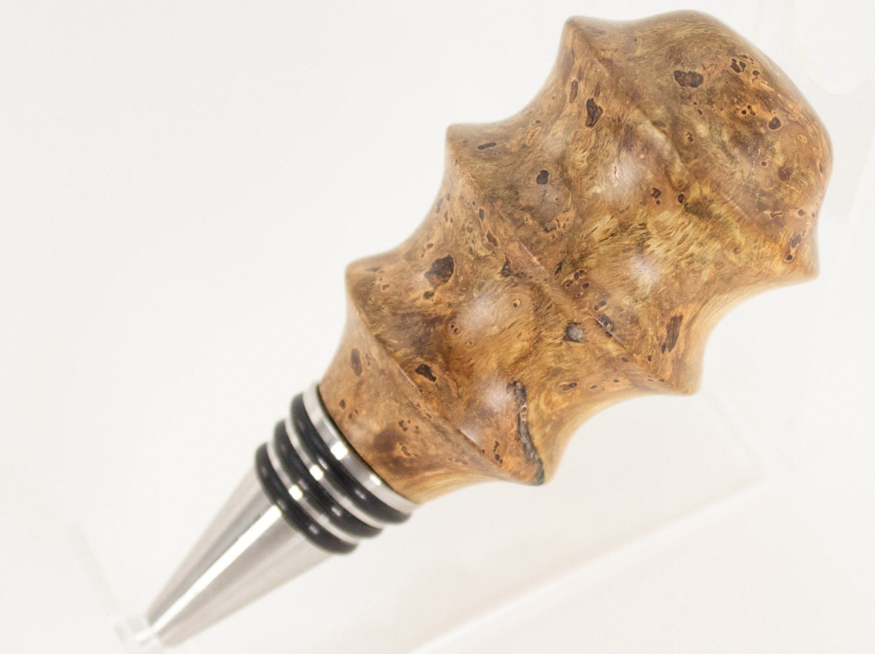 This handmade wooden stopper is made from Black Cherry Burl. This custom one-of-a-kind wooden wine stopper was turned from a burl that was harvested next to the Kennebec River in Maine.