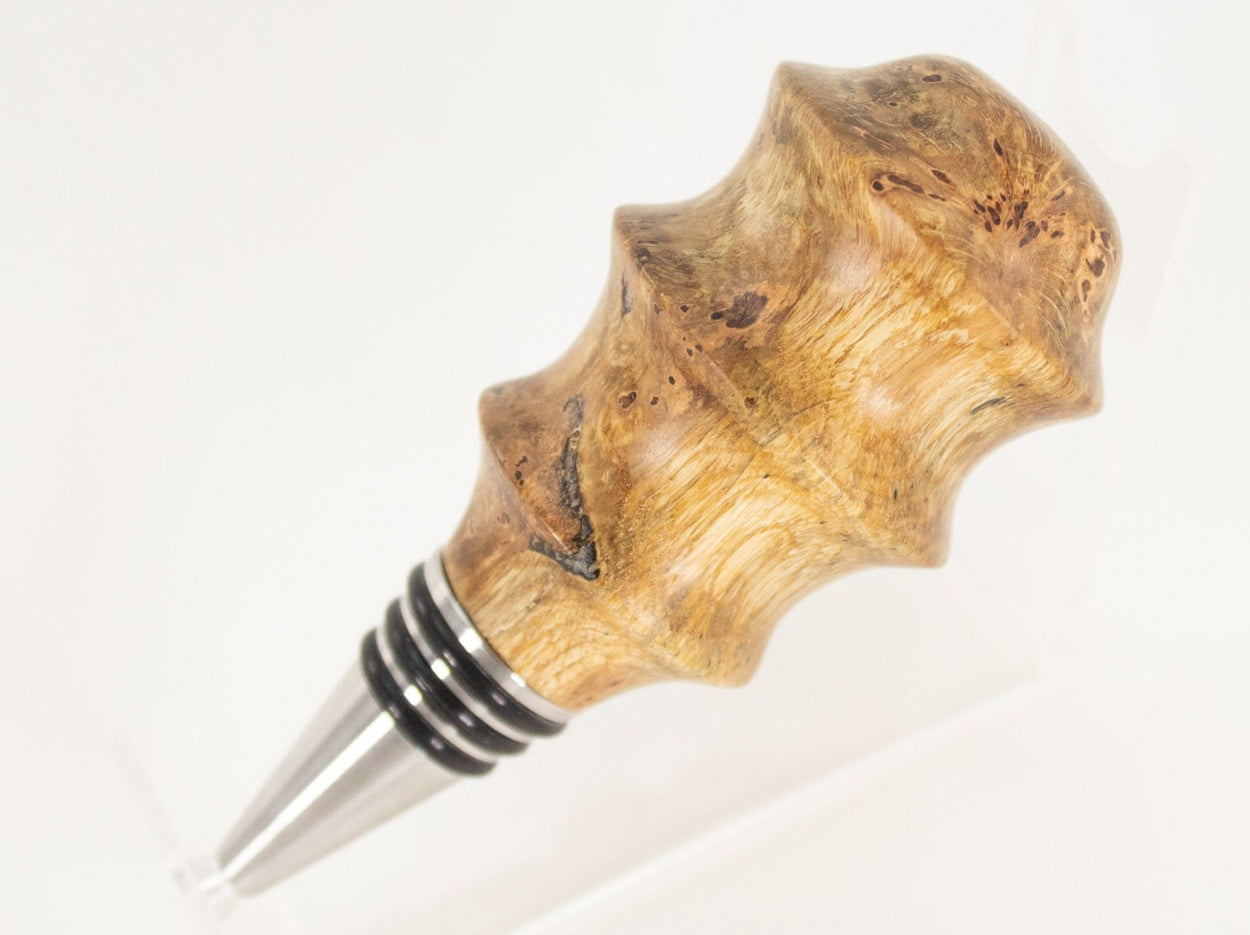 This handmade wooden stopper is made from Black Cherry Burl. This custom one-of-a-kind wooden wine stopper was turned from a burl that was harvested next to the Kennebec River in Maine.