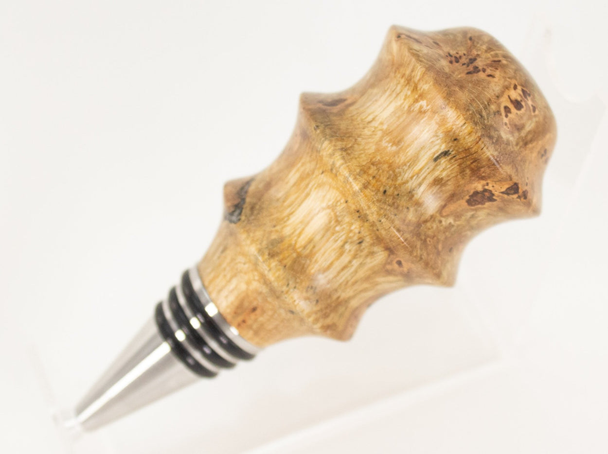 This handmade wooden stopper is made from Black Cherry Burl. This custom one-of-a-kind wooden wine stopper was turned from a burl that was harvested next to the Kennebec River in Maine.