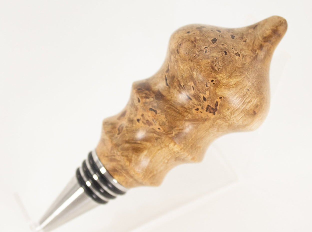 This handmade wooden stopper is made from Black Cherry Burl. This custom one-of-a-kind wooden wine stopper was turned from a burl that was harvested next to the Kennebec River in Maine.
