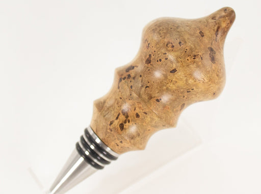 This handmade wooden stopper is made from Black Cherry Burl. This custom one-of-a-kind wooden wine stopper was turned from a burl that was harvested next to the Kennebec River in Maine.