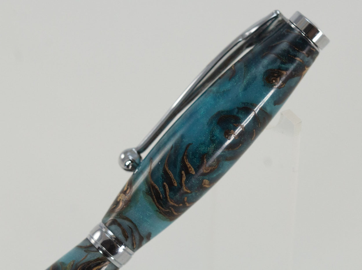 This handcrafted pen is made from (epoxy resin) and pinecones. It provides a firm and comfortable grip. The clip and rings on the cap, barrel, and tip enhance the pen’s beauty. This classic twist pen, the Slimline is an all-time favorite. Quality components like the Swiss-made carbide writing tip make the Slimline pen a fantastic writing choice.