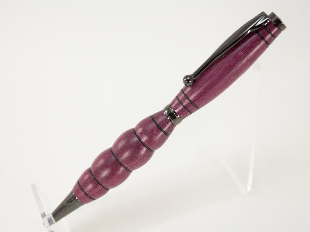 This handcrafted pen is made from Purple Heartwood, providing a firm and comfortable grip. The clip and rings on the cap, barrel, and tip enhance the pen’s beauty. This classic twist pen, the Slimline is an all-time favorite. Quality components like the Swiss-made carbide writing tip make the Slimline pen a fantastic writing choice.