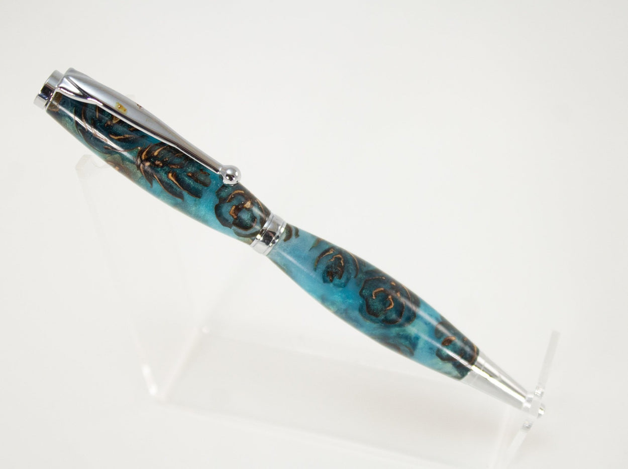 This handcrafted pen is made from (epoxy resin) and pinecones. It provides a firm and comfortable grip. The clip and rings on the cap, barrel, and tip enhance the pen’s beauty. This classic twist pen, the Slimline is an all-time favorite. Quality components like the Swiss-made carbide writing tip make the Slimline pen a fantastic writing choice.