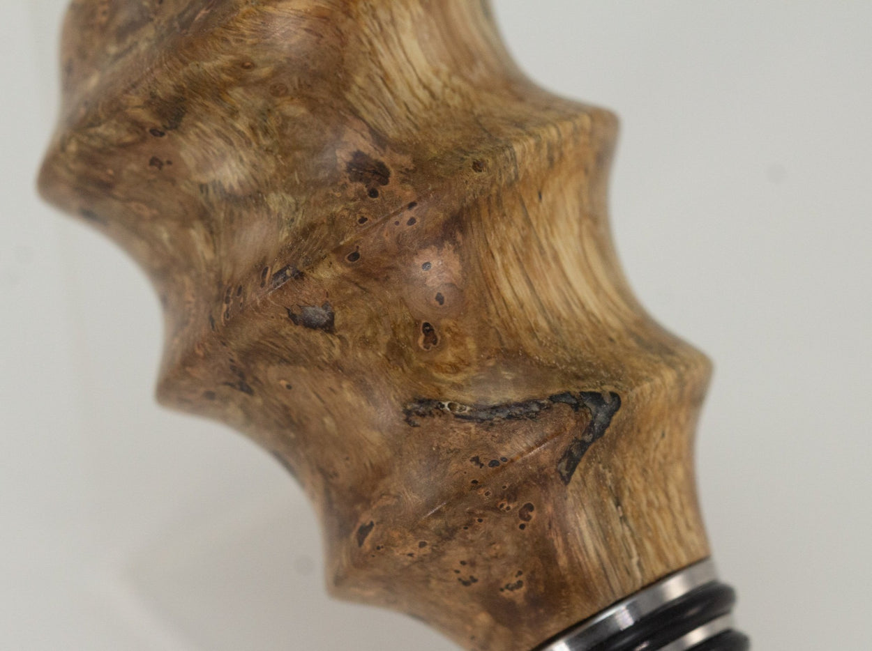 This handmade wooden stopper is made from Black Cherry Burl. This custom one-of-a-kind wooden wine stopper was turned from a burl that was harvested next to the Kennebec River in Maine.