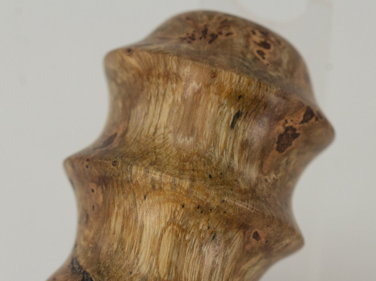 This handmade wooden stopper is made from Black Cherry Burl. This custom one-of-a-kind wooden wine stopper was turned from a burl that was harvested next to the Kennebec River in Maine.
