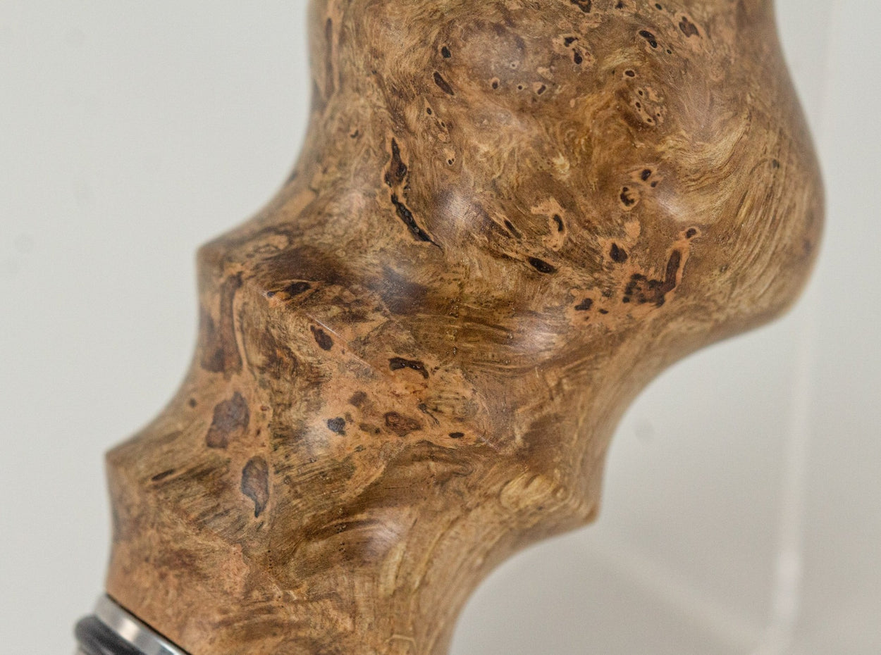 This handmade wooden stopper is made from Black Cherry Burl. This custom one-of-a-kind wooden wine stopper was turned from a burl that was harvested next to the Kennebec River in Maine.