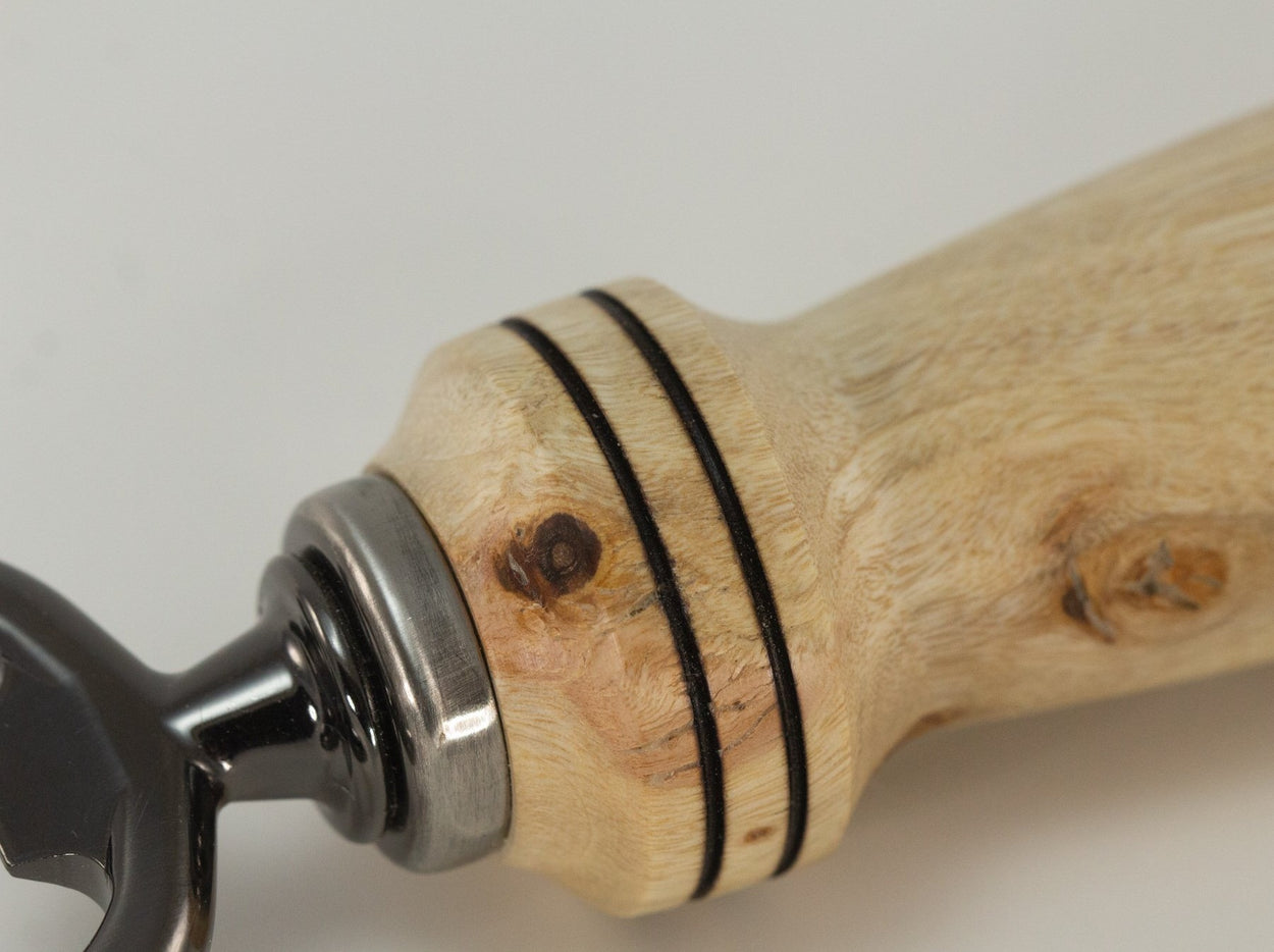 This handmade wooden bottle opener is made from (Campher). This wood came from Phoesbes Forest in California. The hardware is (Stainless Steel, pewter in color) This custom one-of-a-kind wooden bottle opener will definitely impress your friends.