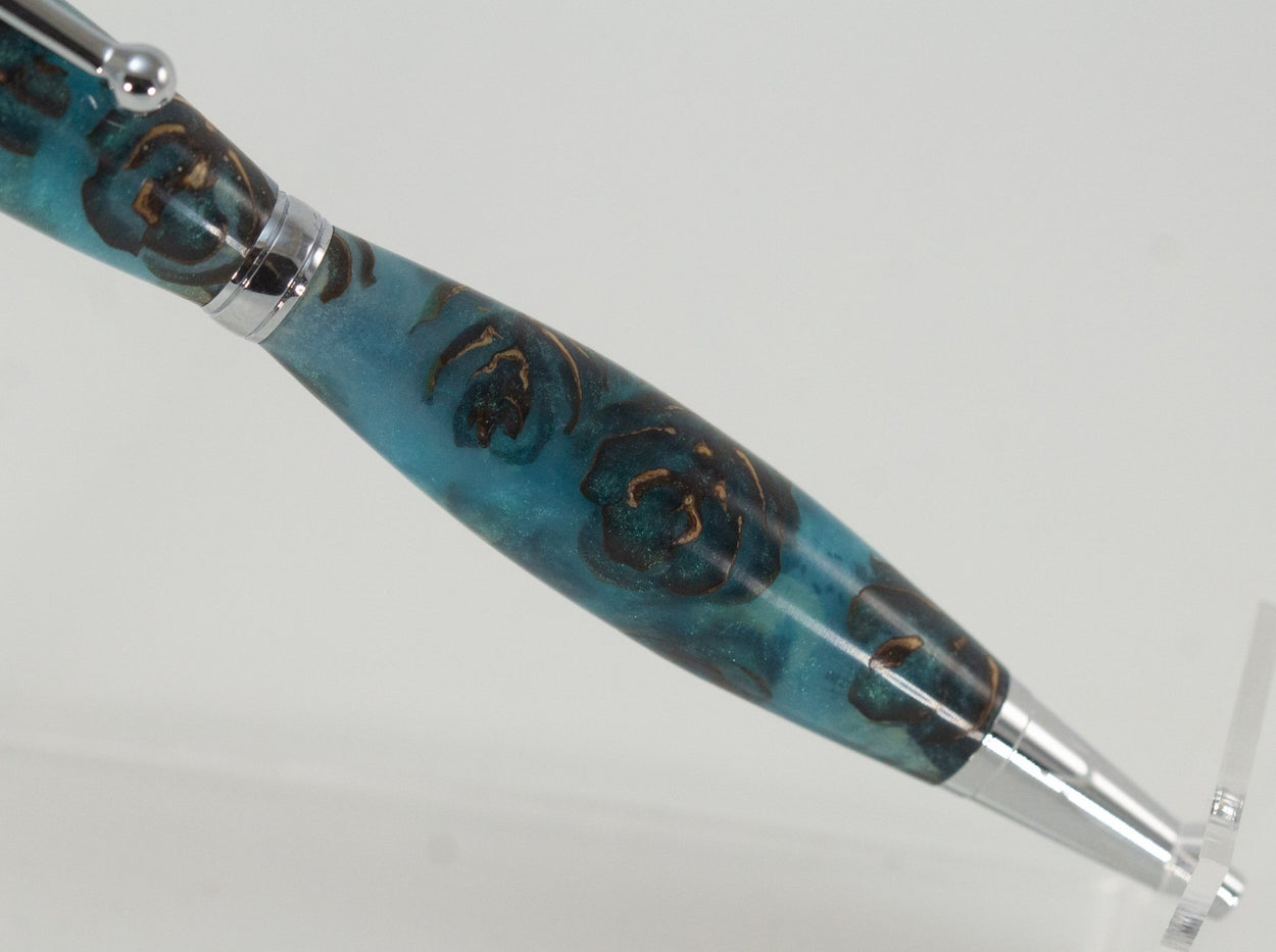 This handcrafted pen is made from (epoxy resin) and pinecones. It provides a firm and comfortable grip. The clip and rings on the cap, barrel, and tip enhance the pen’s beauty. This classic twist pen, the Slimline is an all-time favorite. Quality components like the Swiss-made carbide writing tip make the Slimline pen a fantastic writing choice.